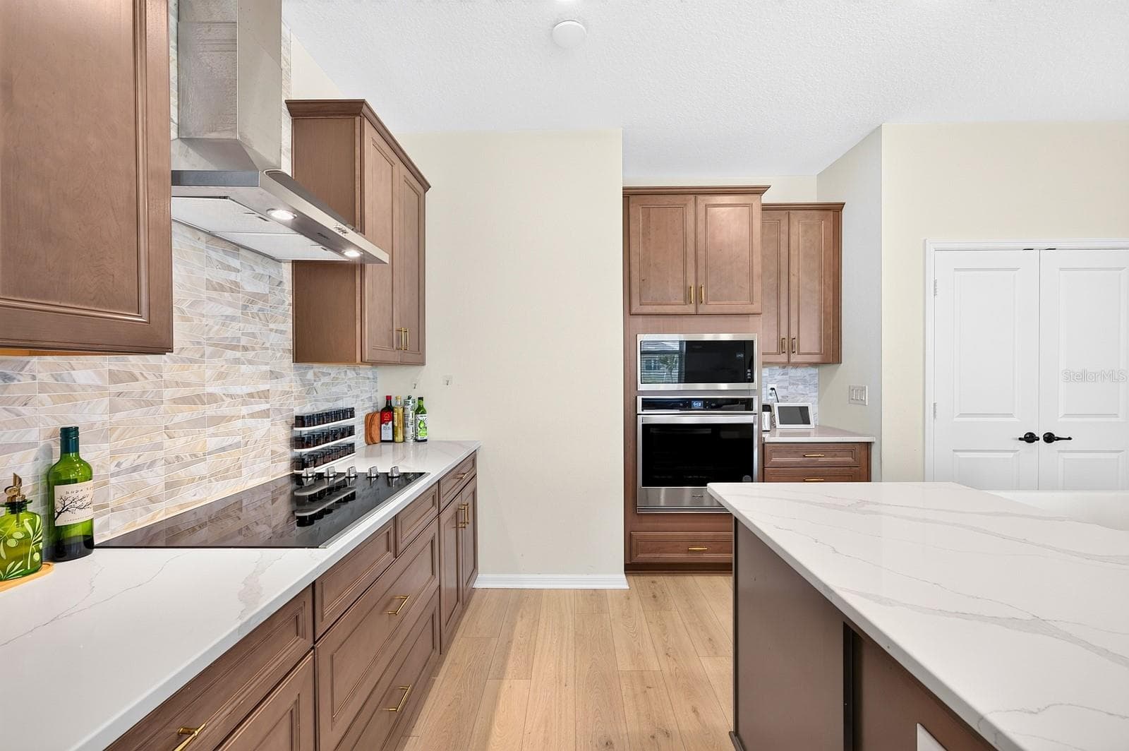 The stunning Kitchen is designed to impress. - 1785 PETIOLE PL, KISSIMMEE