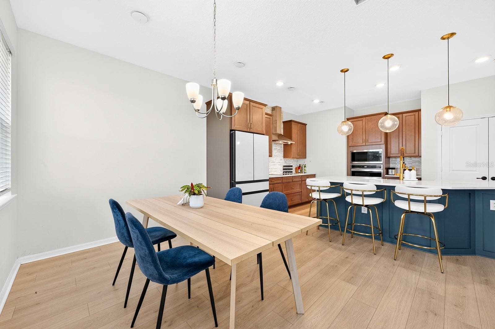 A well-placed Dining area maximizes functionality while maintaining a cozy atmosphere. - 1785 PETIOLE PL, KISSIMMEE