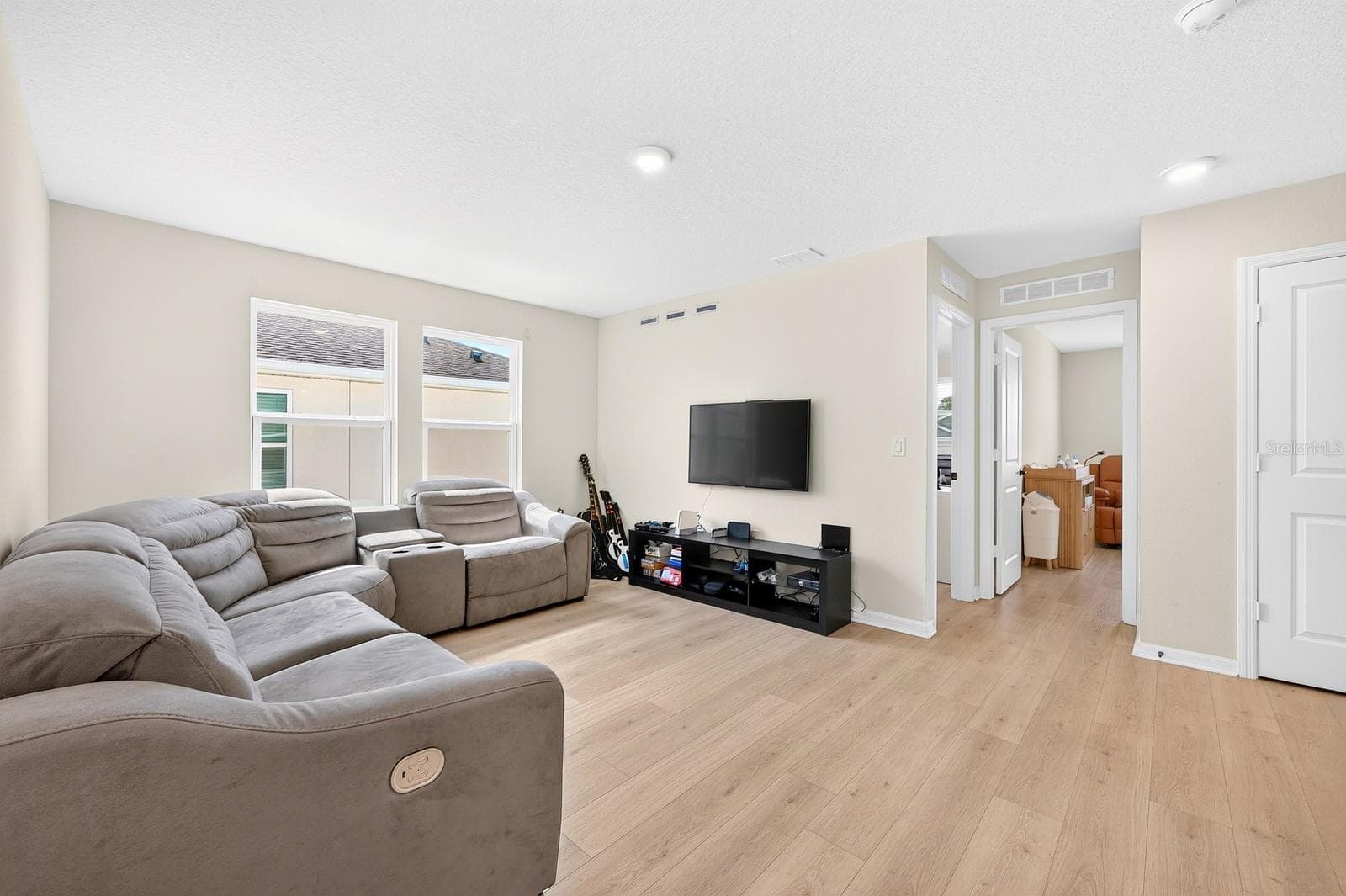 Upstairs, a SPACIOUS LOFT offers additional living space—perfect for a game room, media area or a comfortable place to gather. - 1785 PETIOLE PL, KISSIMMEE