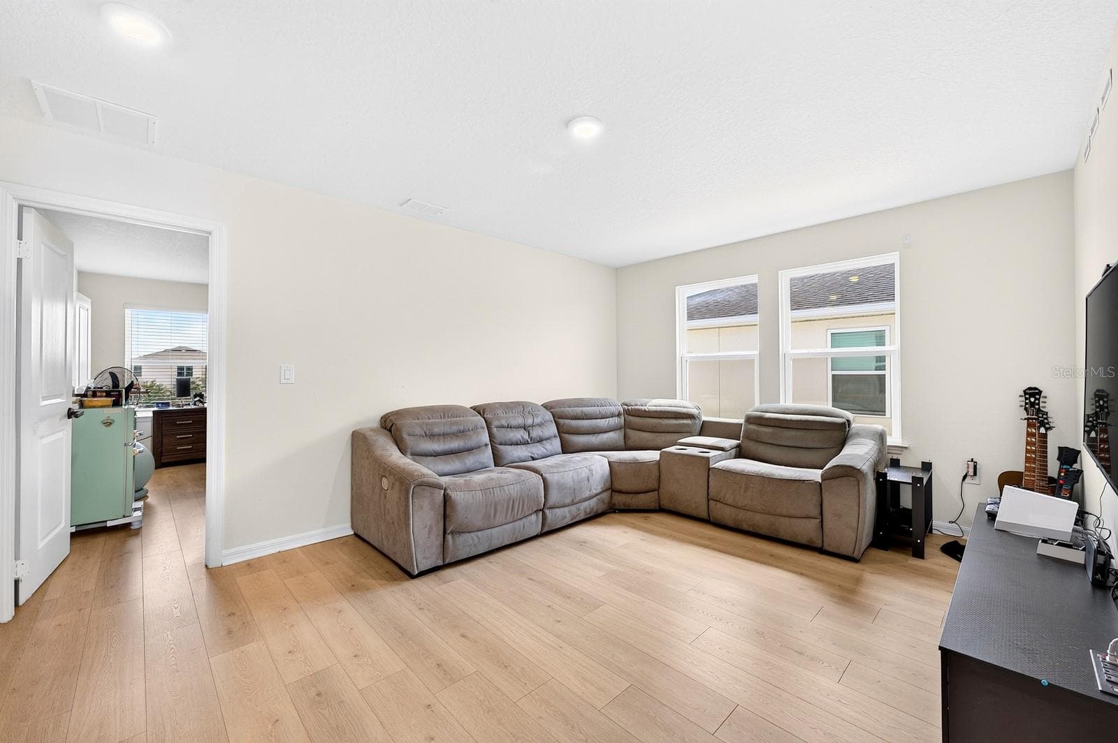 Upstairs, a SPACIOUS LOFT offers additional living space—perfect for a game room, media area or a comfortable place to gather. - 1785 PETIOLE PL, KISSIMMEE