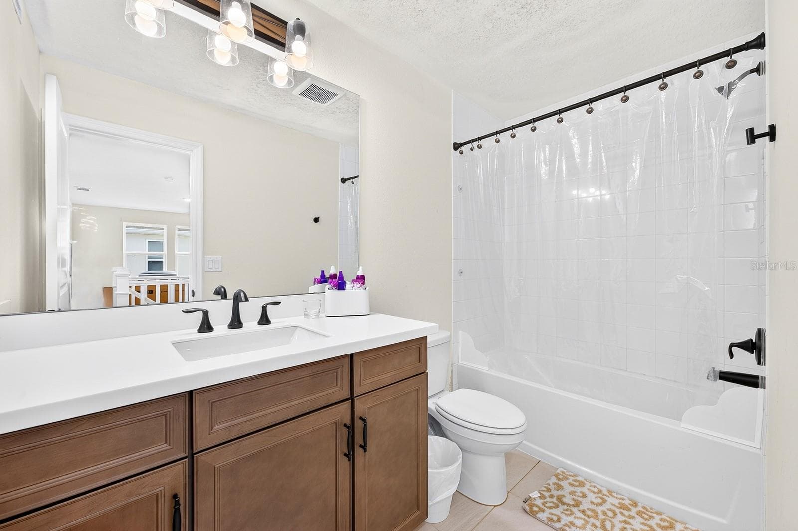 A well-appointed third Bathroom complements the secondary Bedrooms. - 1785 PETIOLE PL, KISSIMMEE