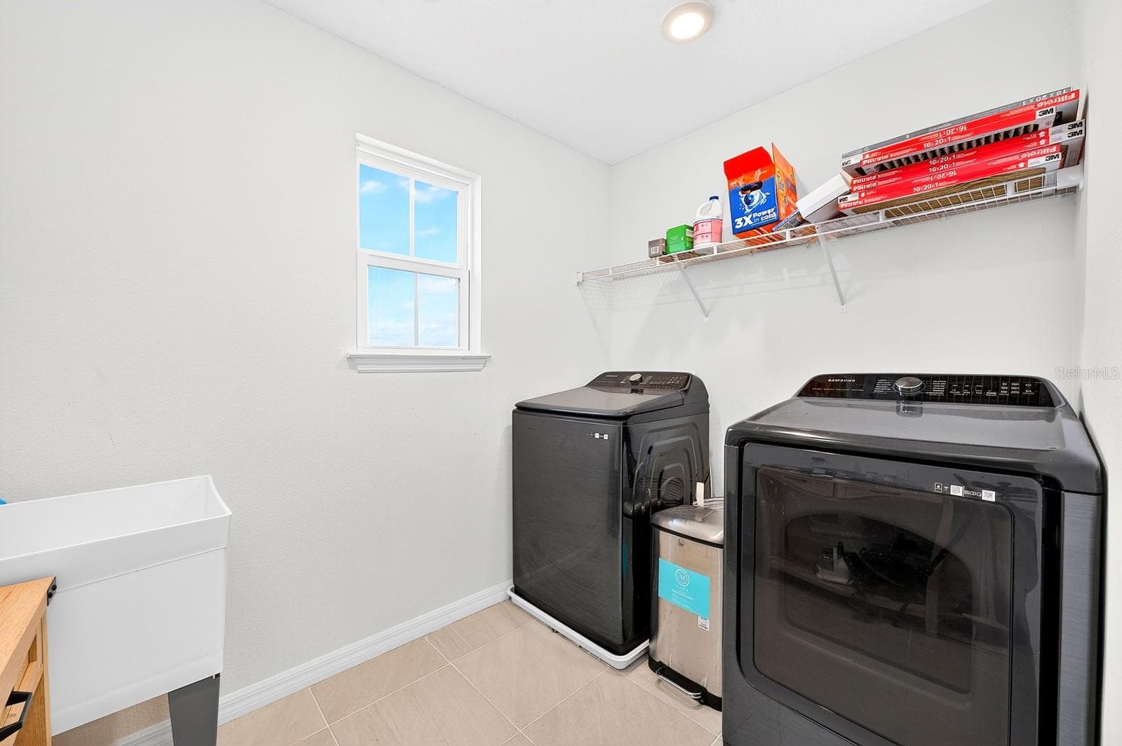 An upstairs Laundry Room with a utility sink completes the second floor. - 1785 PETIOLE PL, KISSIMMEE