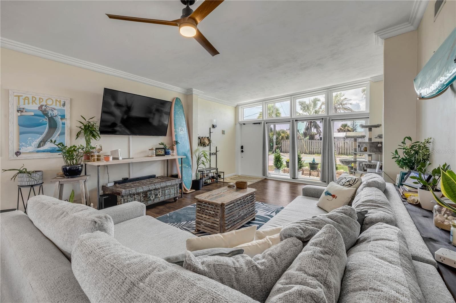 Living room with generous windows and natural light. - 3929 S PENINSULA DR, PORT ORANGE