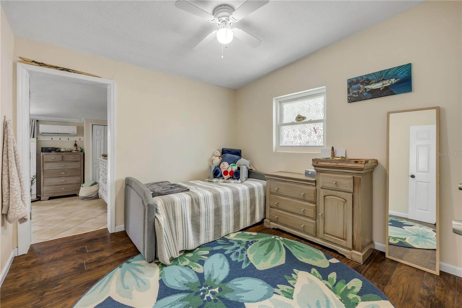 Bedroom with wood flooring and a ceiling fan. - 3929 S PENINSULA DR, PORT ORANGE