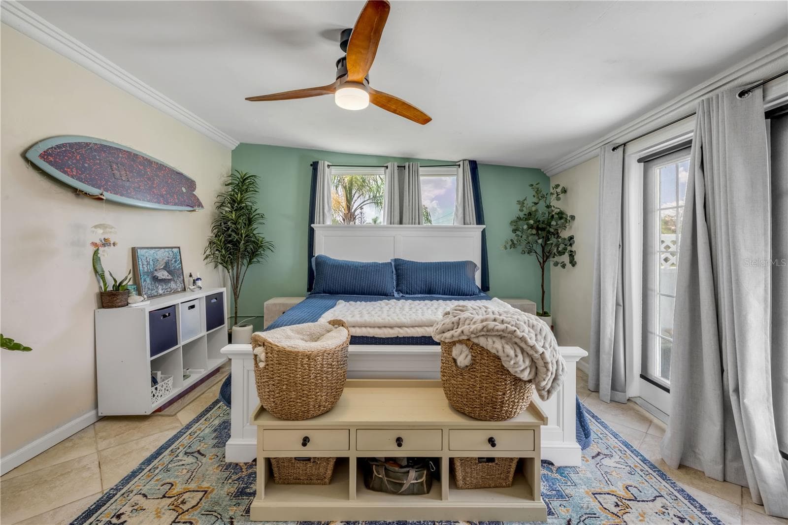 Bright sitting area with windows and a ceiling fan. - 3929 S PENINSULA DR, PORT ORANGE