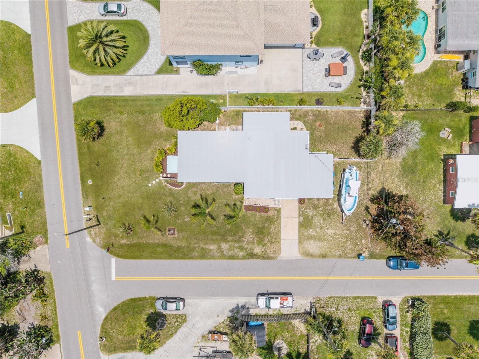 Overhead view of the home, driveway and surrounding lot. - 3929 S PENINSULA DR, PORT ORANGE