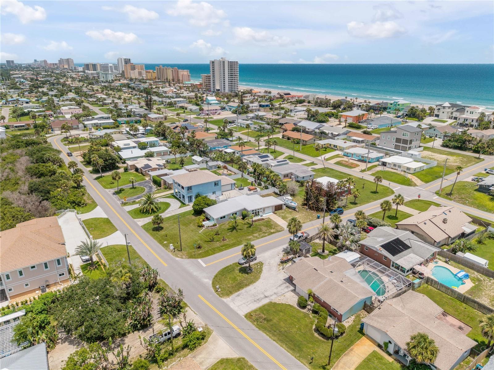 Neighborhood aerial showing the surrounding coastal community. - 3929 S PENINSULA DR, PORT ORANGE