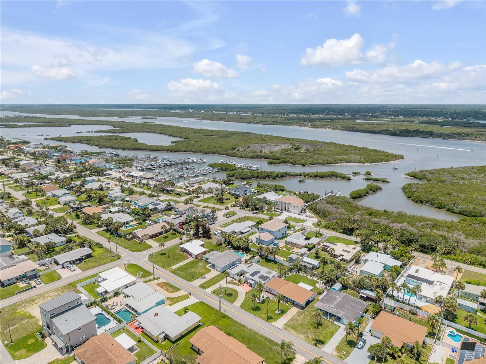 Wide aerial of the neighborhood and nearby waterways. - 3929 S PENINSULA DR, PORT ORANGE