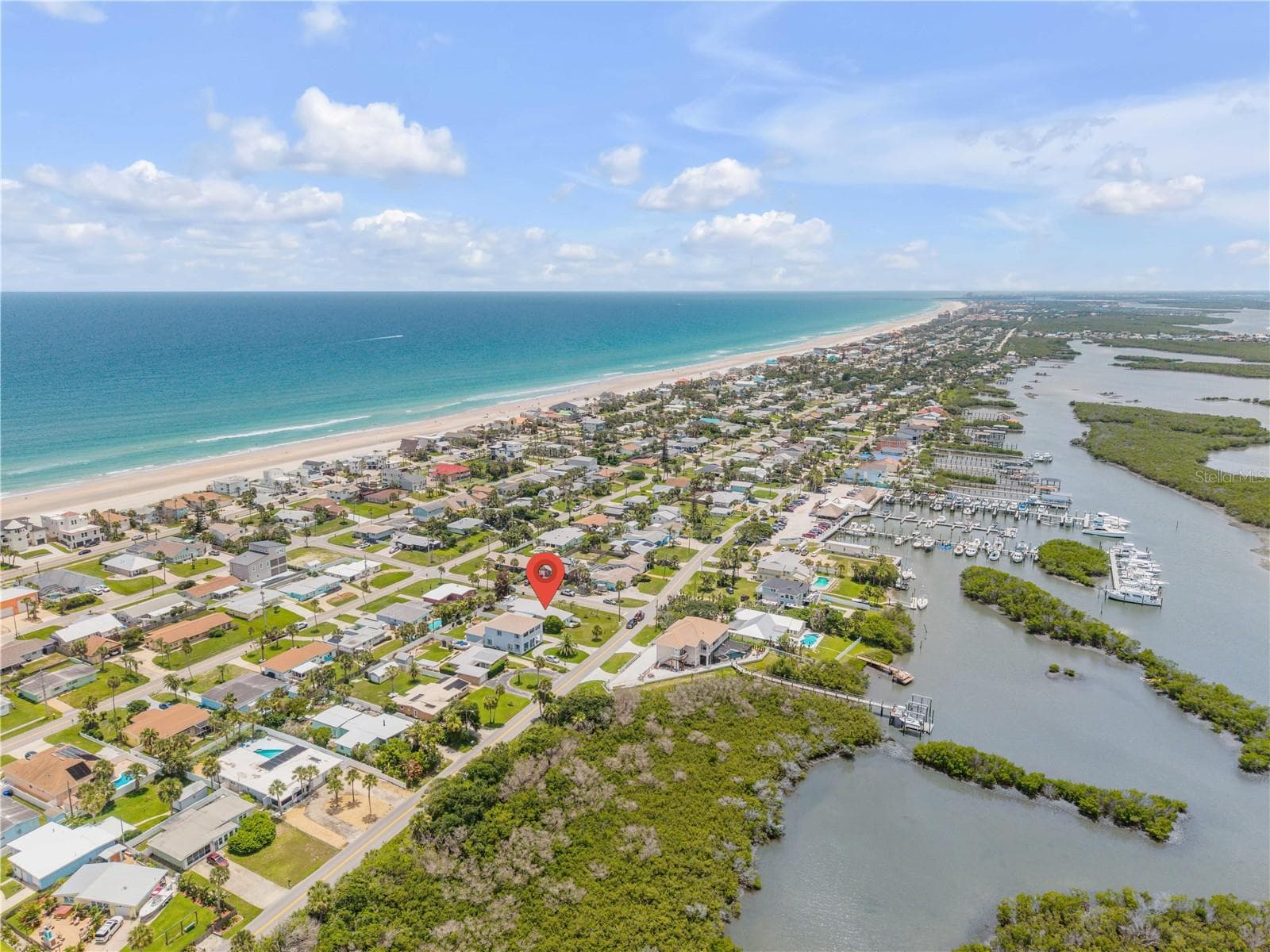 Coastal aerial showing the Atlantic shoreline and surrounding community. - 3929 S PENINSULA DR, PORT ORANGE