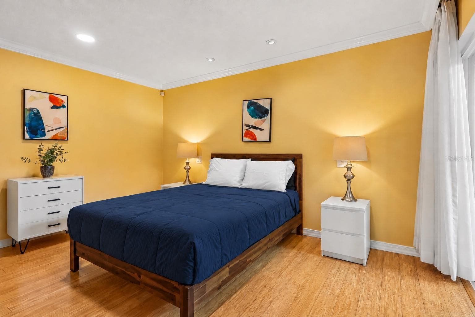 The Primary Suite provides a TRANQUIL ESCAPE, featuring sliding doors leading directly to the conservatory, dual closets, and an EN SUITE BATH. - 632 DESOTO DR #632, CASSELBERRY