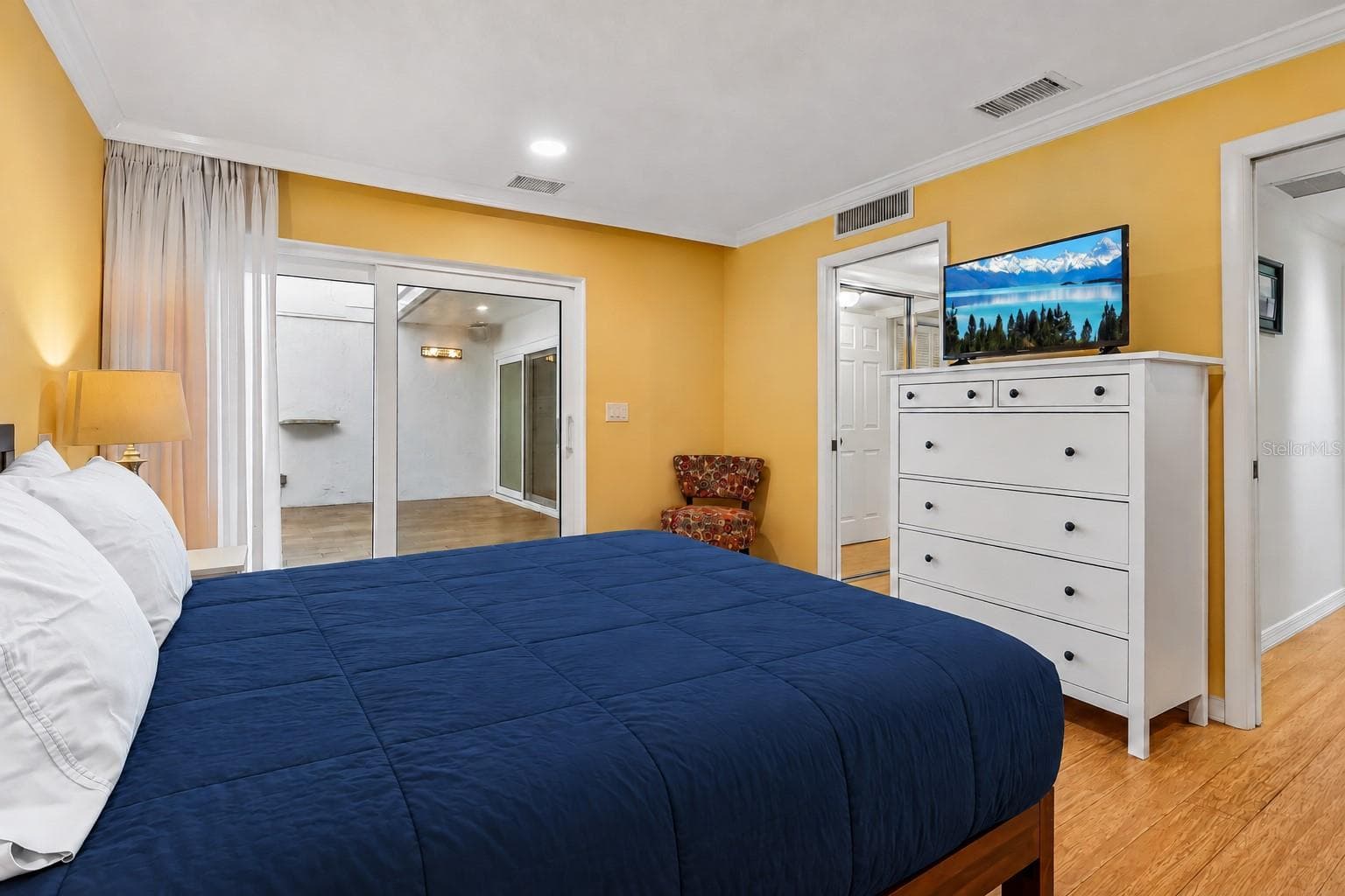 The Primary Suite provides a TRANQUIL ESCAPE, featuring sliding doors leading directly to the conservatory, dual closets, and an EN SUITE BATH. - 632 DESOTO DR #632, CASSELBERRY