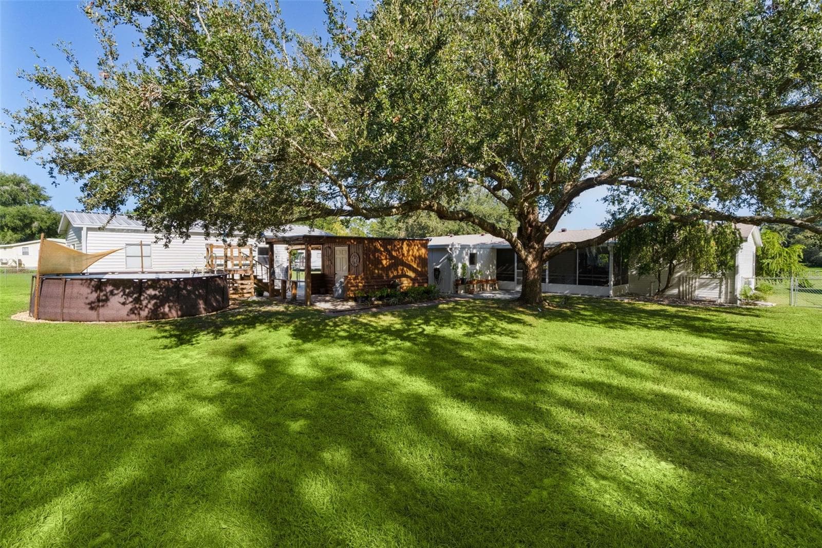 Backyard view - 8333 COUNTY ROAD 109A-1, LADY LAKE