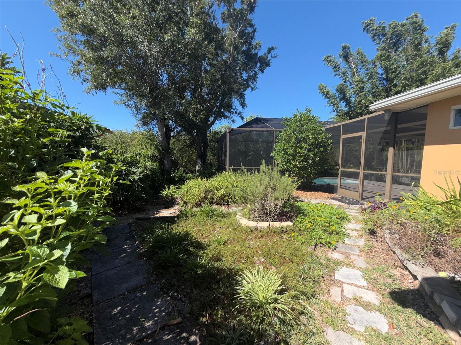 back yard / paths - 1874 WATEROAK DR W, CLEARWATER