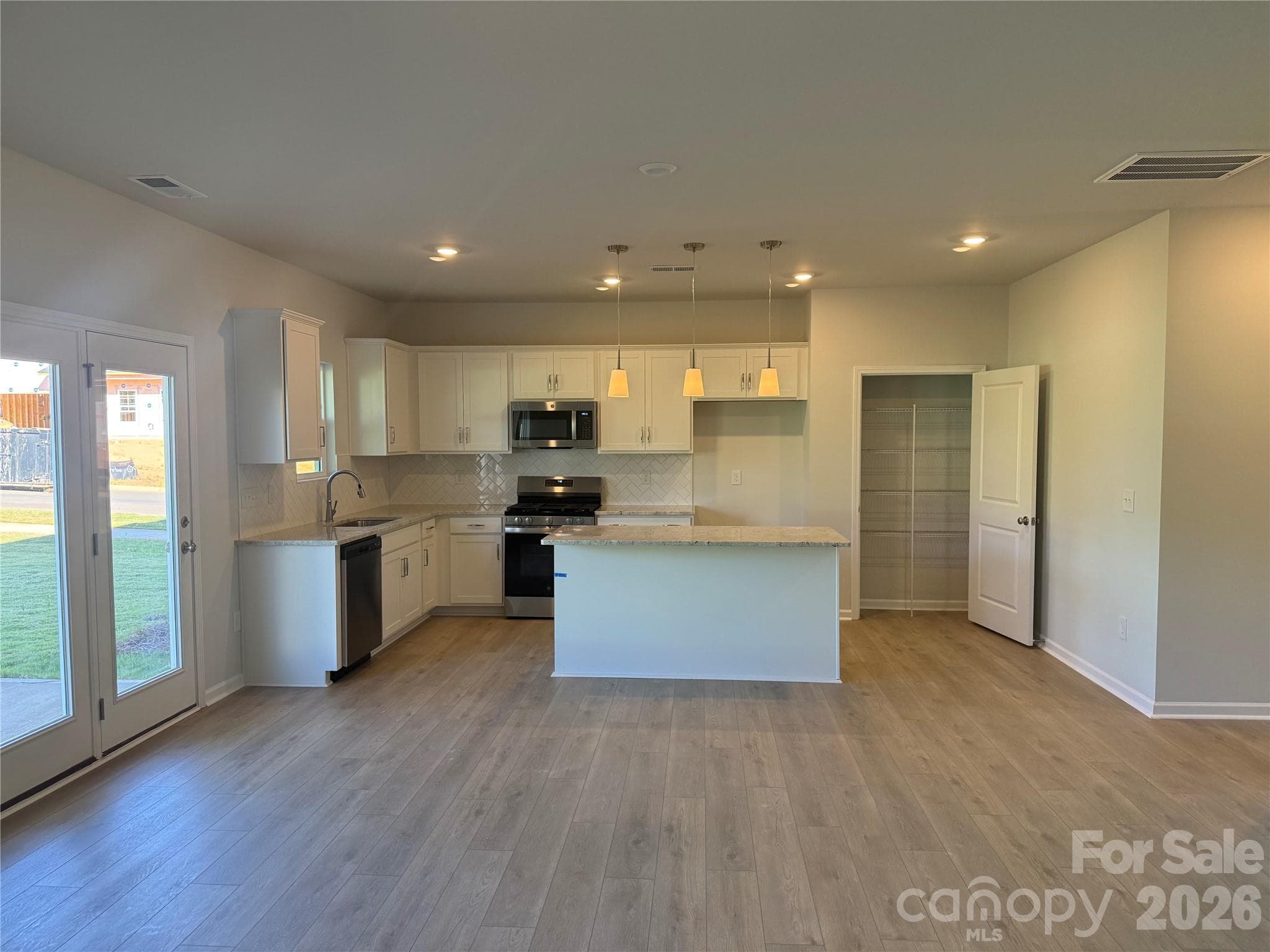 Breakfast area leads out to covered back porch - 1305 Bansal Drive, Charlotte