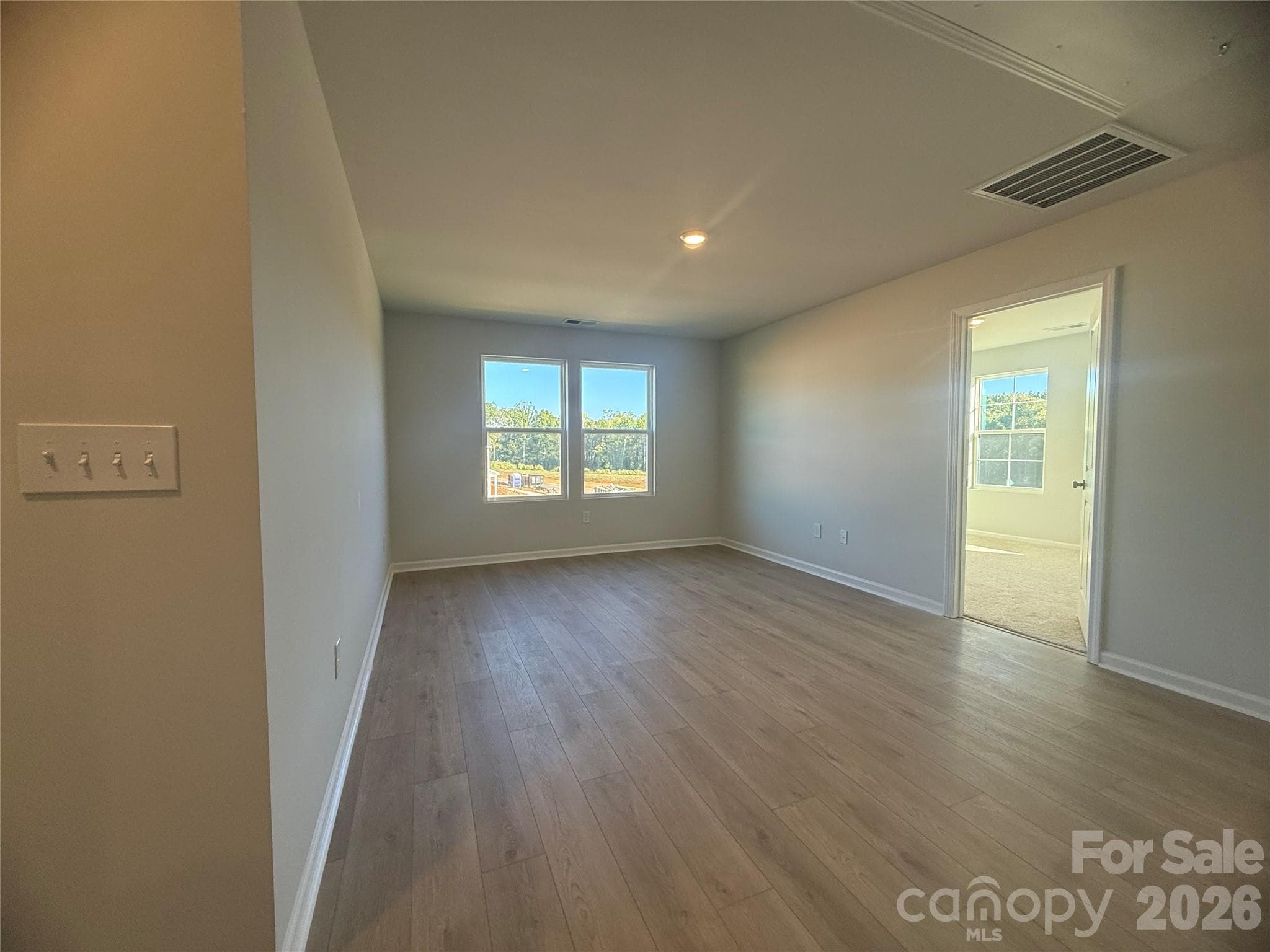 Oak Tread Stairs lead to a spacious upstairs loft - 1305 Bansal Drive, Charlotte