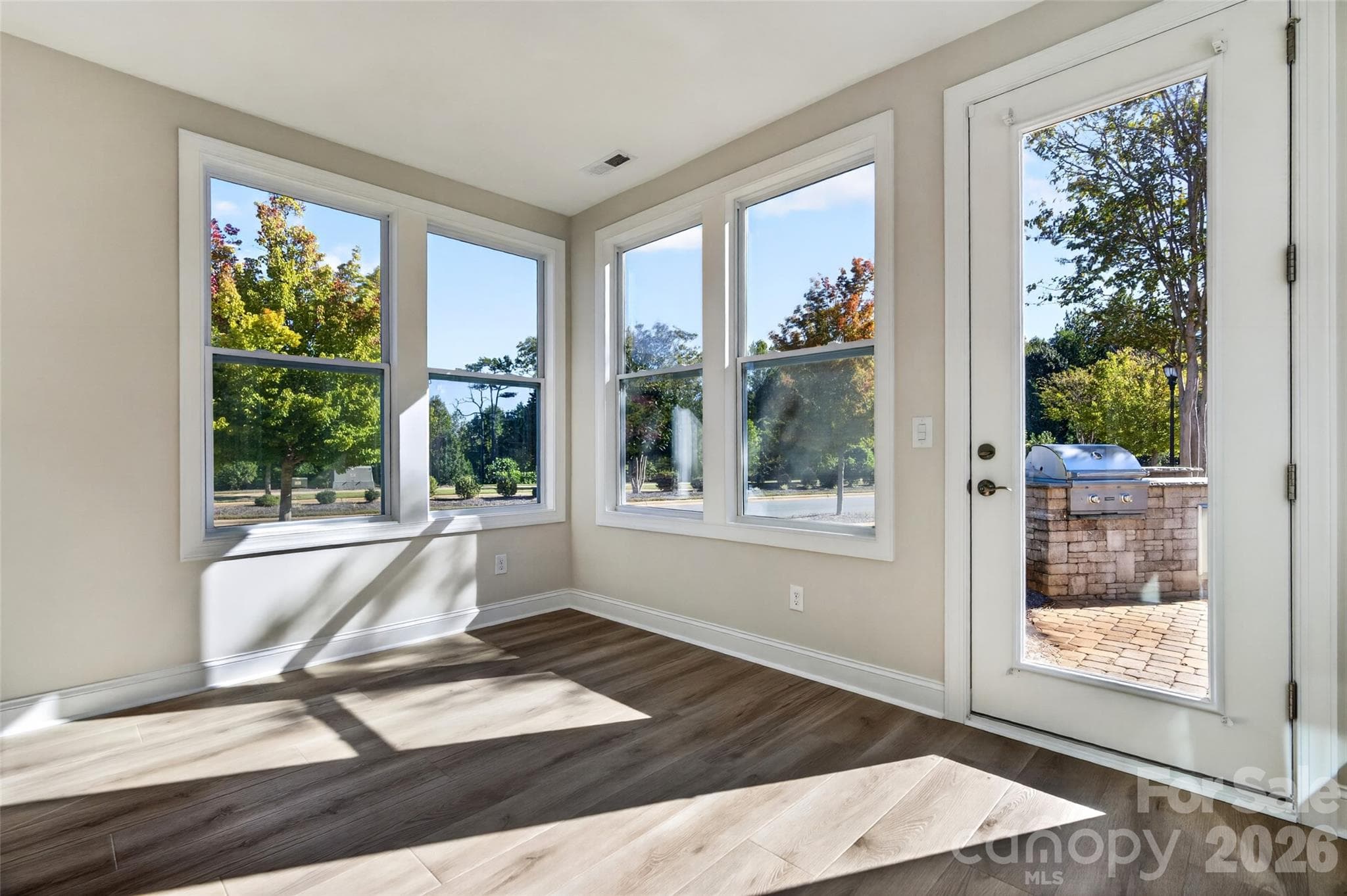 Extended Sunroom leading onto a custom paver patio - 8905 Silver Springs Court, Charlotte