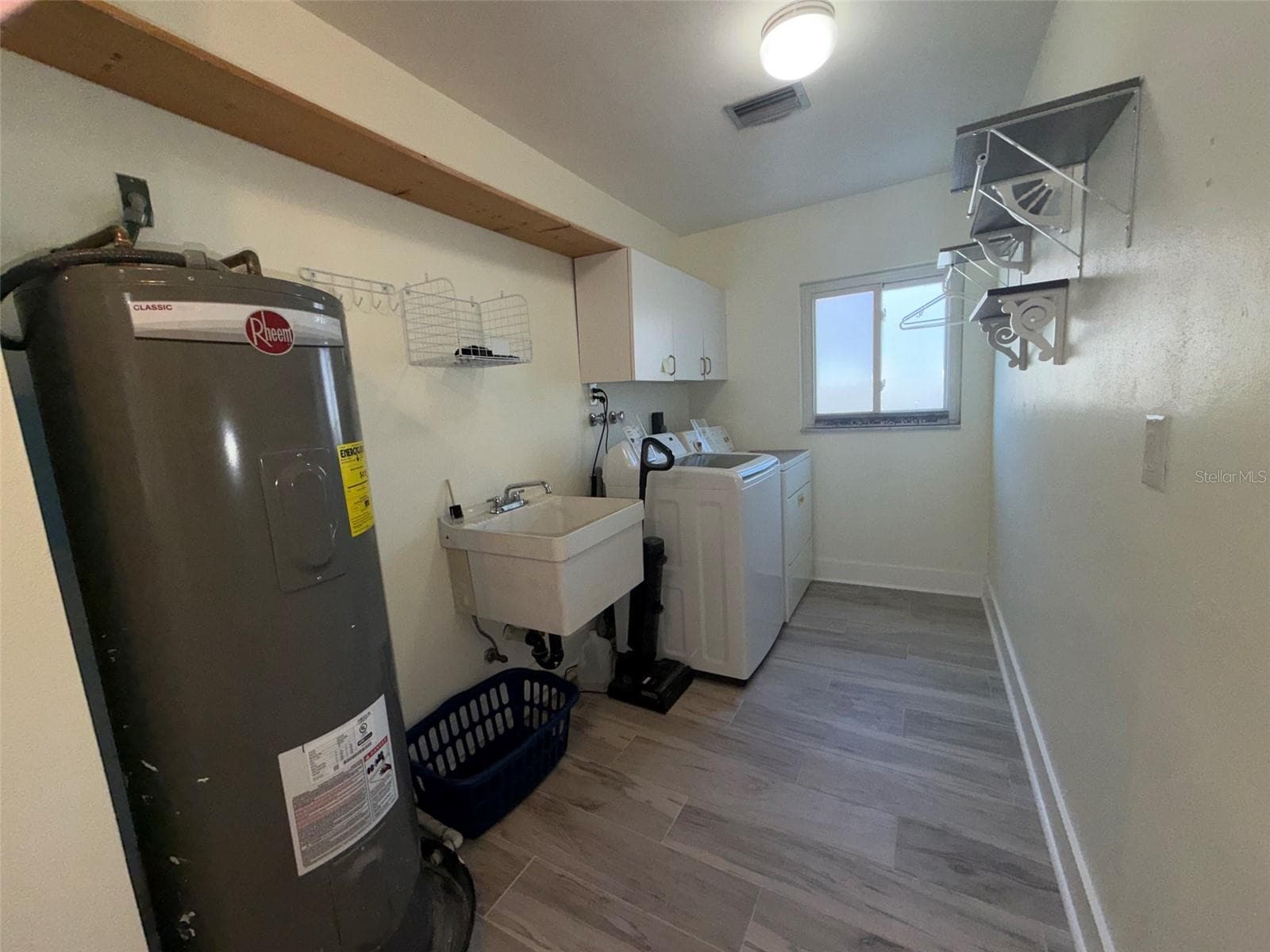 Inside laundry room - 1874 WATEROAK DR W, CLEARWATER