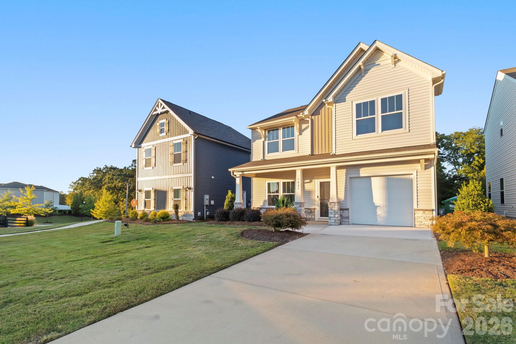 Concrete drive to garage with sheetrock walls and electric garage door opener. - 1023 Freeman View Drive, Albemarle