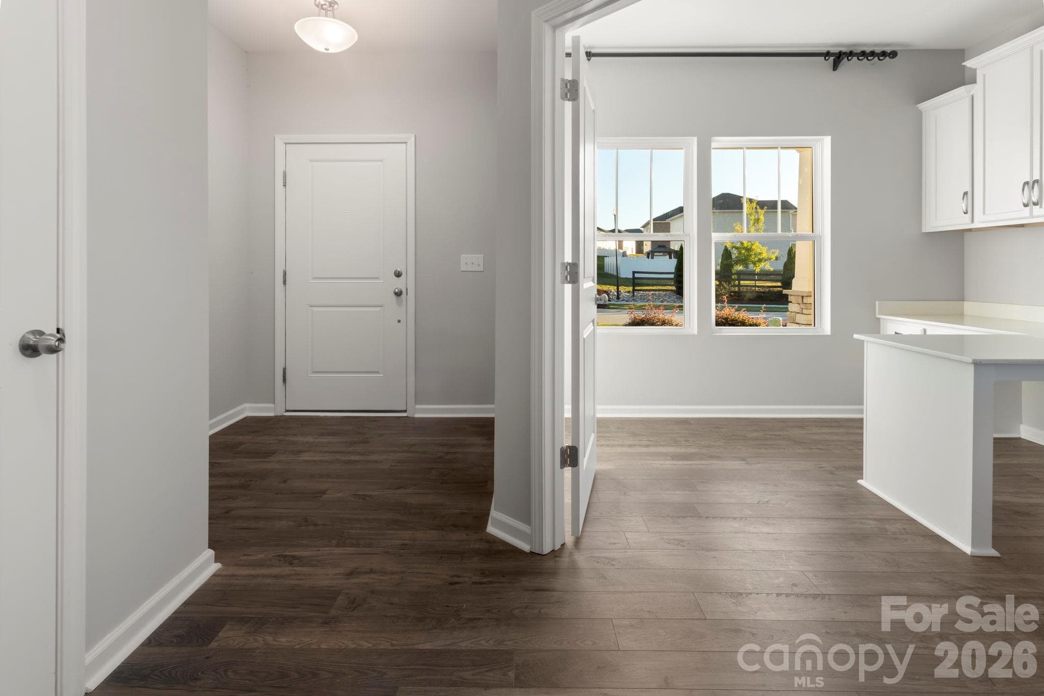 View of foyer and office or study with built in desks and cabinets - 1023 Freeman View Drive, Albemarle
