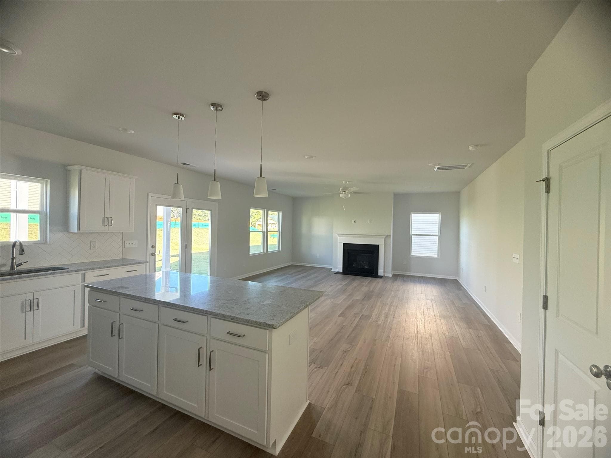 Open kitchen leading into breakfast area & family room - 1227 Bansal Drive, Charlotte