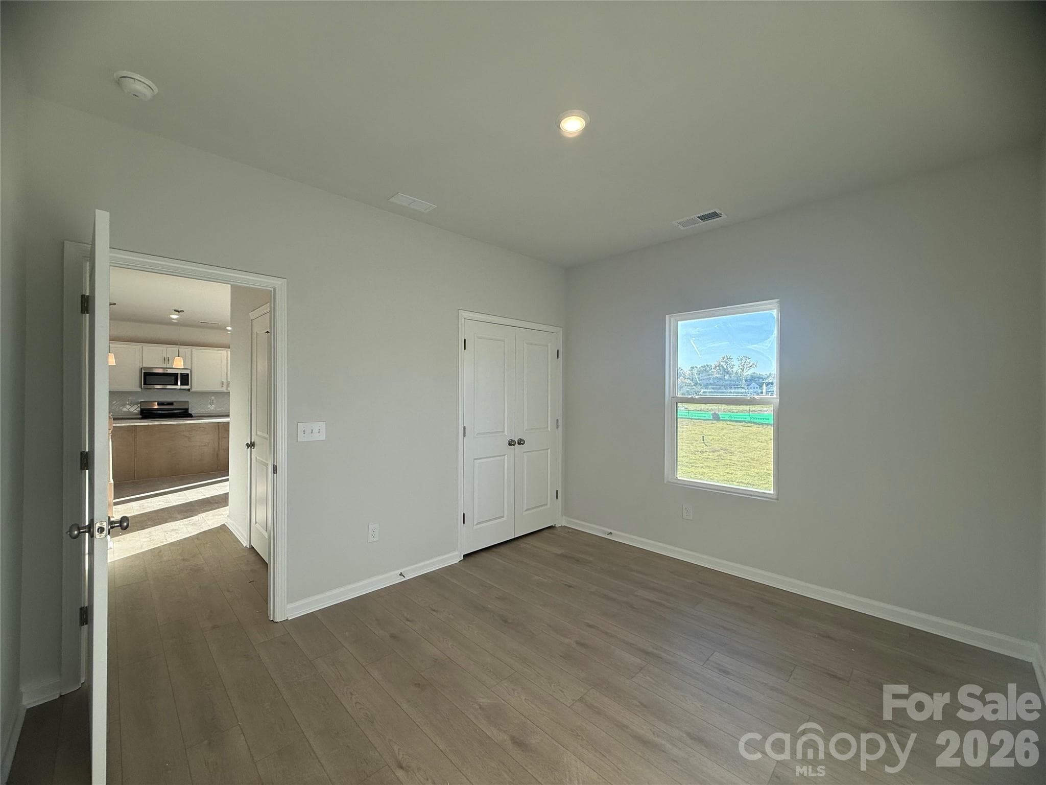 Guest bedroom 1st floor with closet & full bath in hallway - 4021 Juno Drive, Charlotte