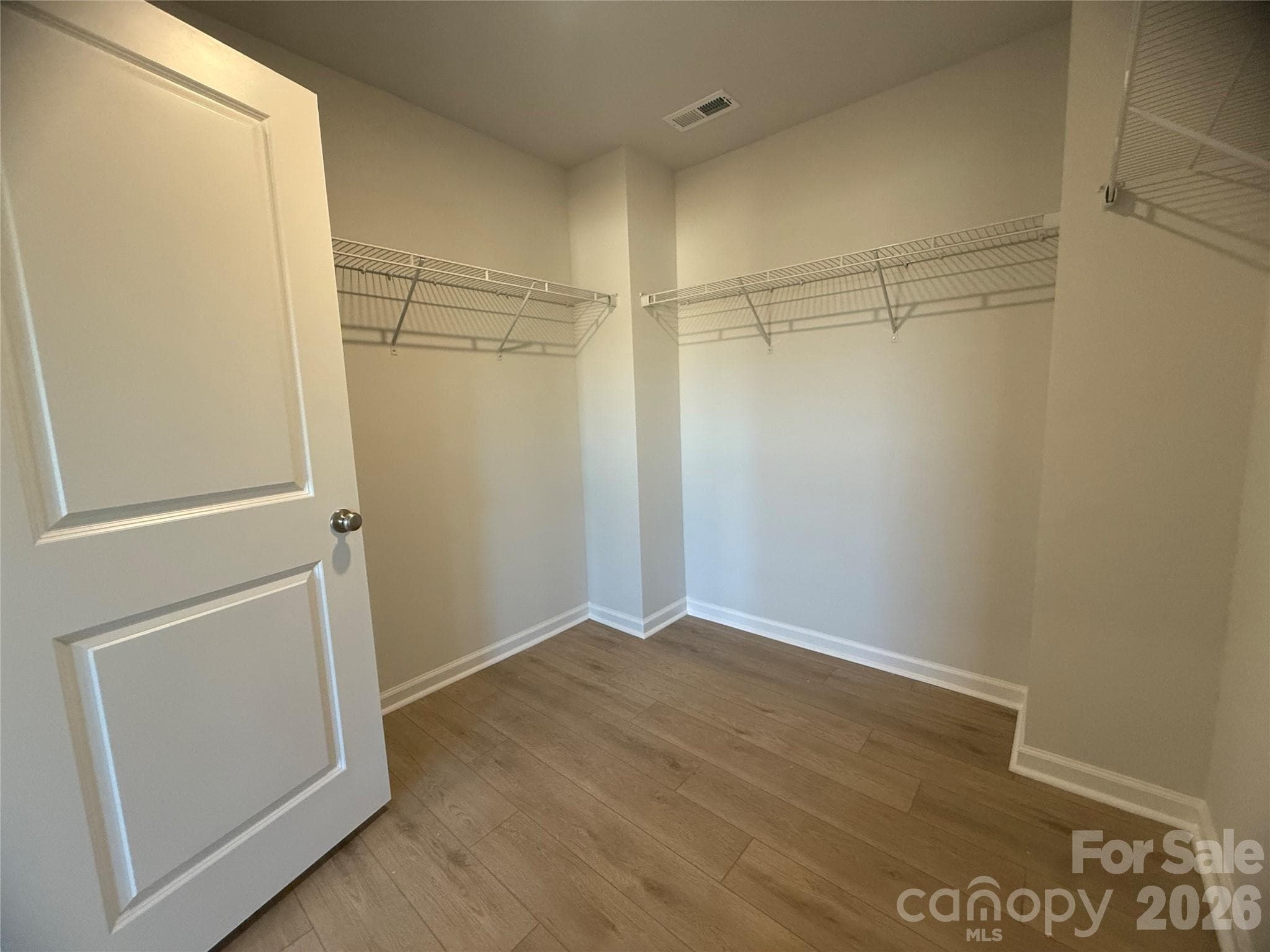 Primary walk-in closet off bedroom - 4021 Juno Drive, Charlotte