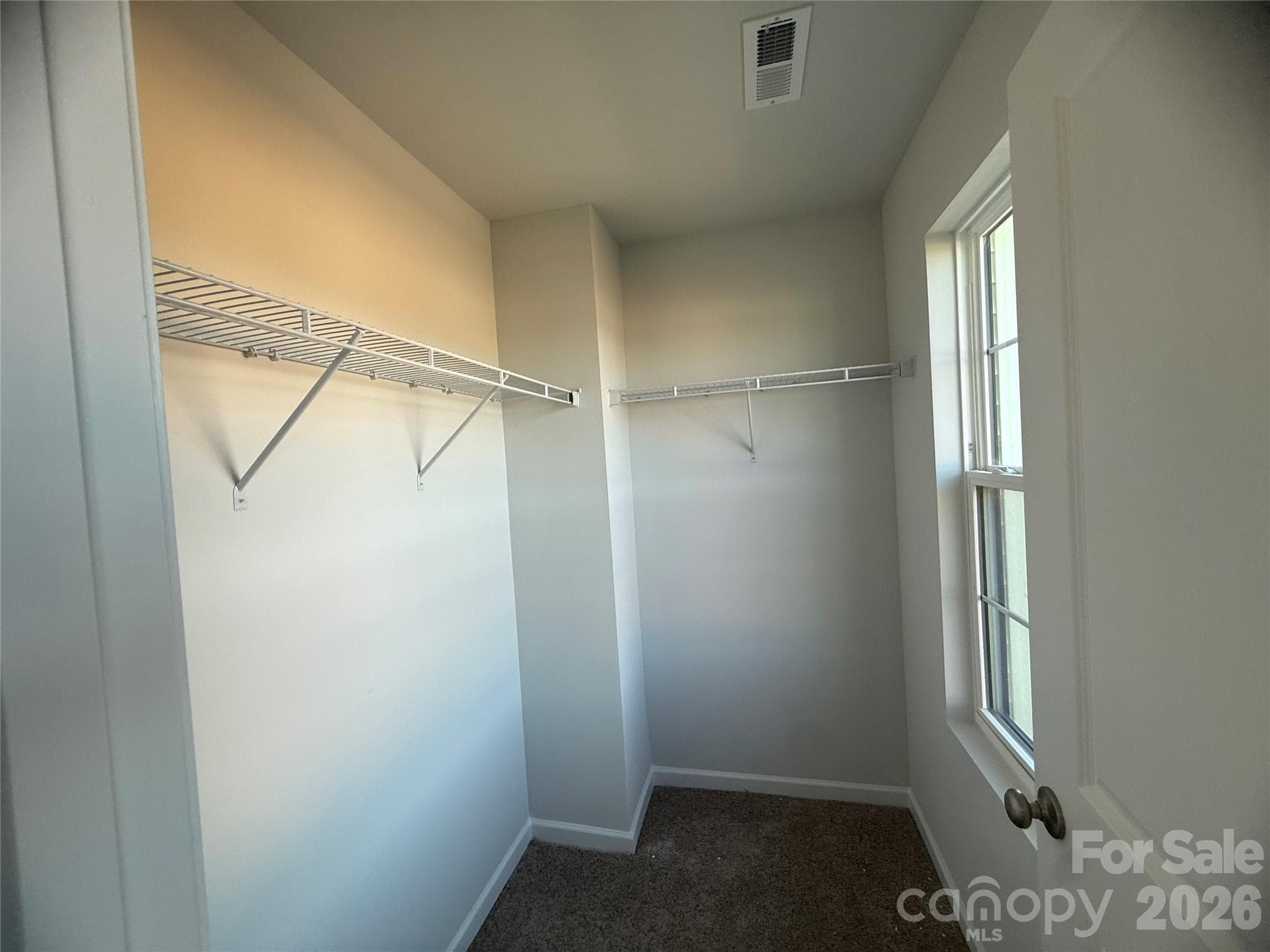 Bedroom 3 walk-in closet with window - 4021 Juno Drive, Charlotte
