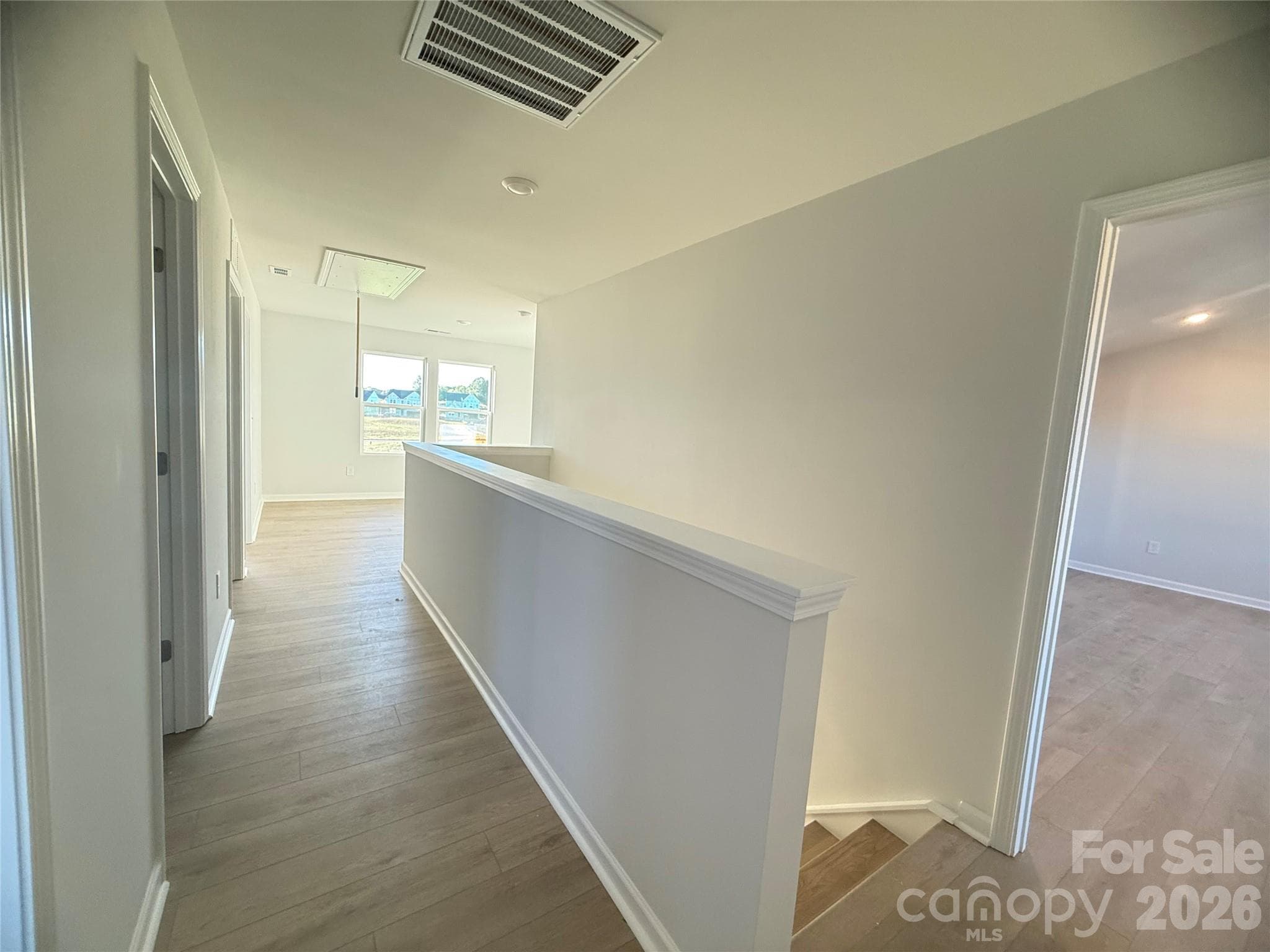Upstairs hallway leading to bedrooms, laundry, full bathroom. & loft - 4021 Juno Drive, Charlotte