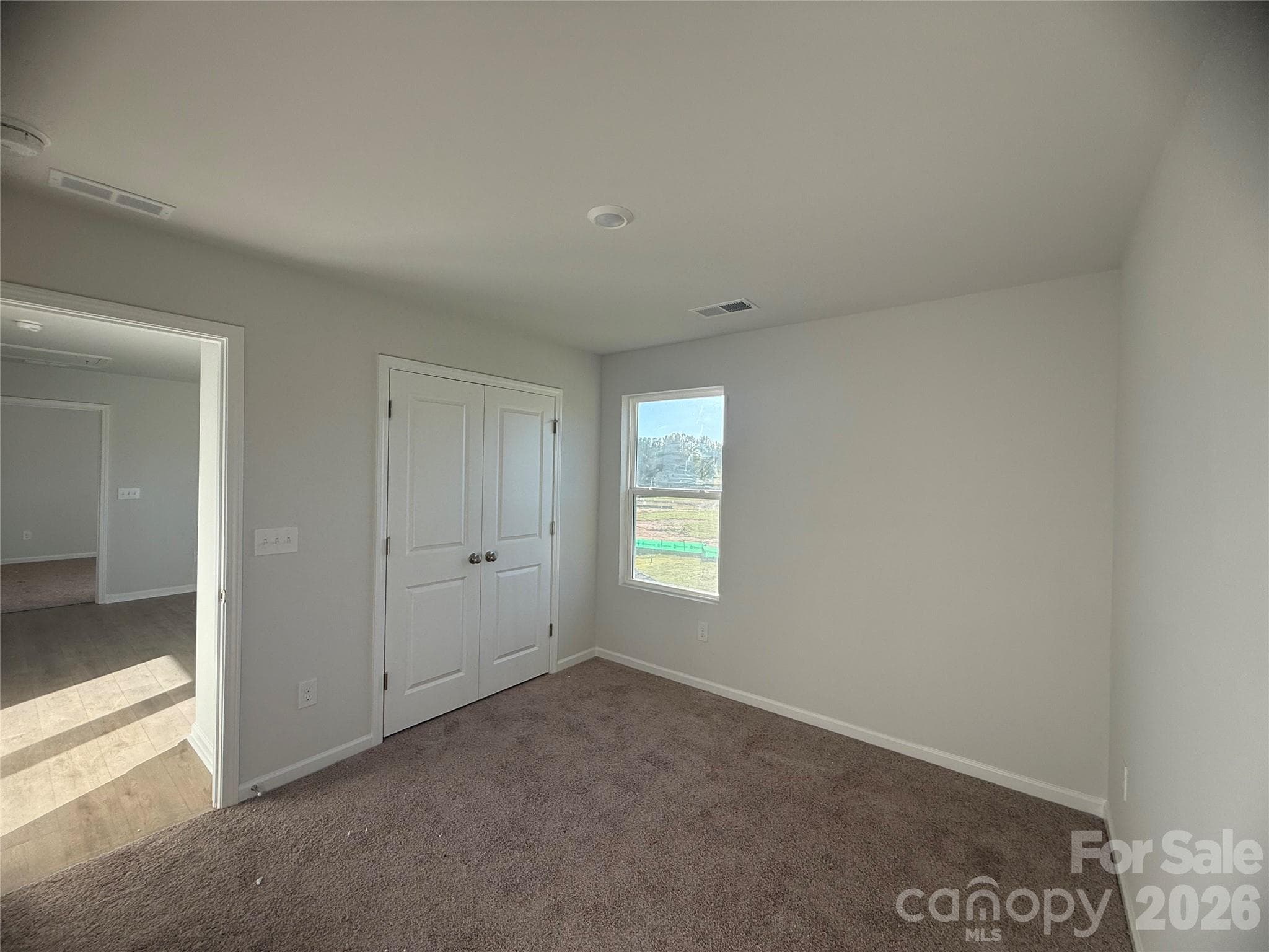 Bedroom with closet with double doors - 4021 Juno Drive, Charlotte