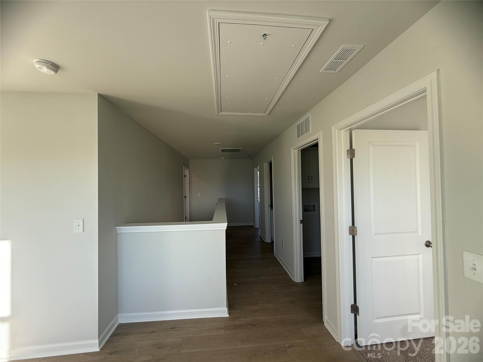 Loft leading back down hallway to stairs - 4021 Juno Drive, Charlotte