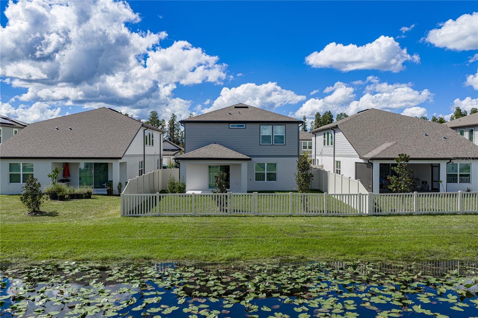 Fully Fenced Conservation Pond Lot with Covered Lanai - 1076 KISTNA DR, ZEPHYRHILLS