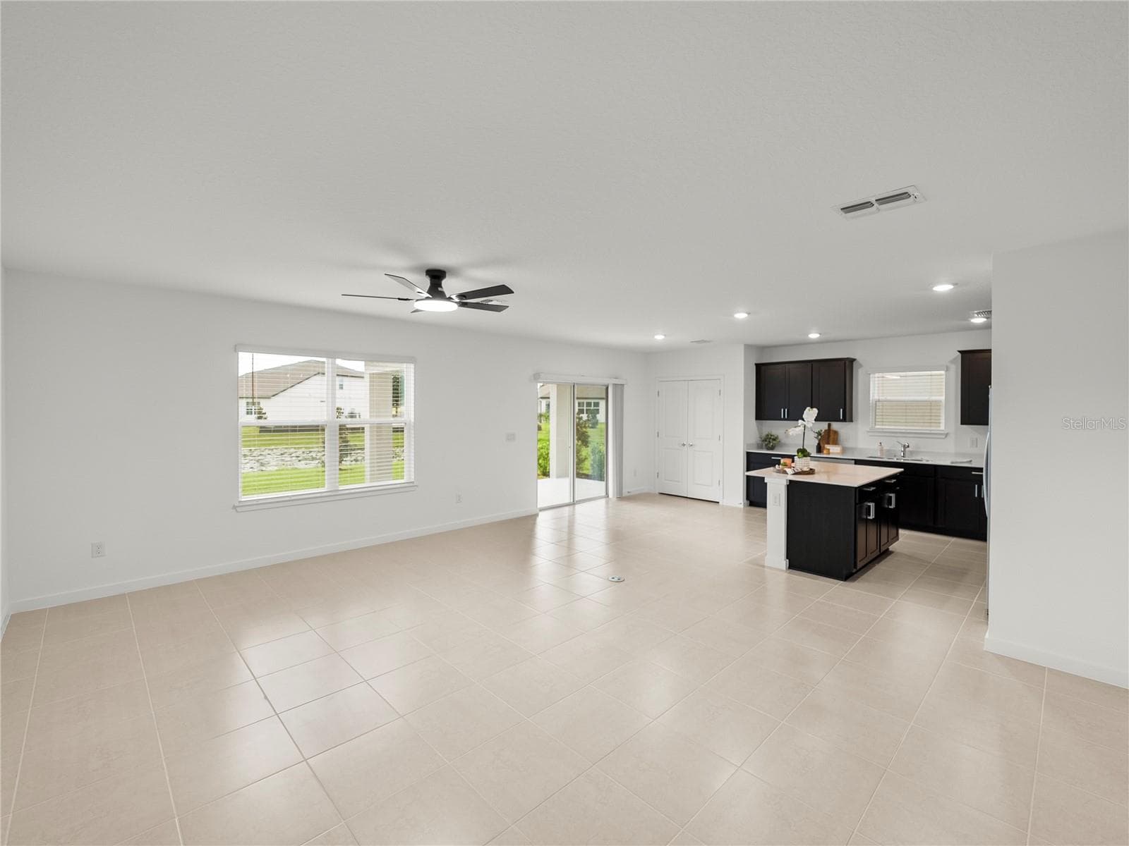 Main Living/Dining and Kitchen Area all Views to Conservation and Pond - 1076 KISTNA DR, ZEPHYRHILLS