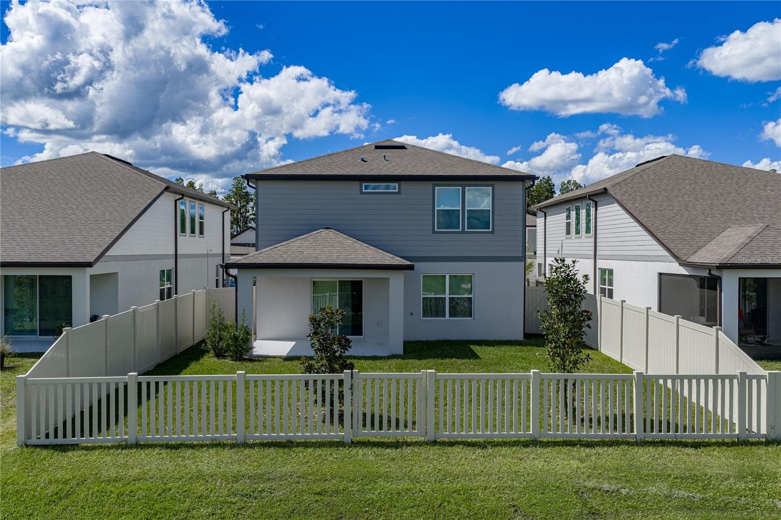 Rear View of Home with Large Fully Fenced Backyard - 1076 KISTNA DR, ZEPHYRHILLS