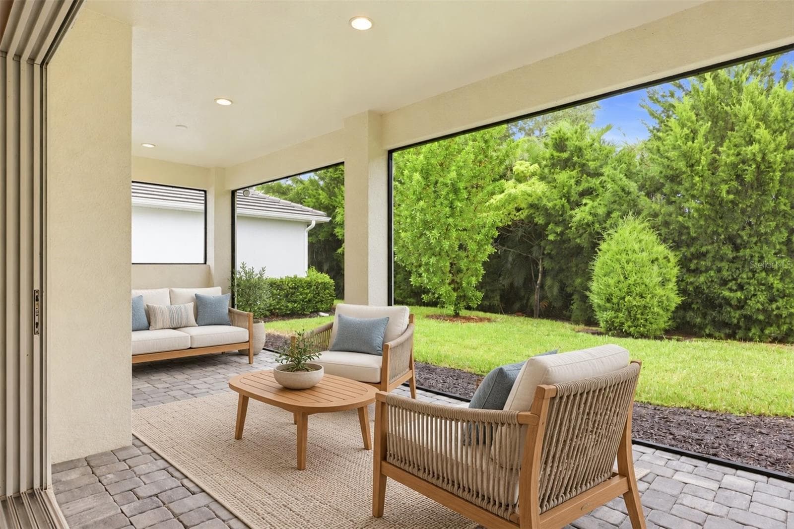Expansive Screened Lanai with Paver Bricks - 7717 SANDHILL LAKE DR, SARASOTA