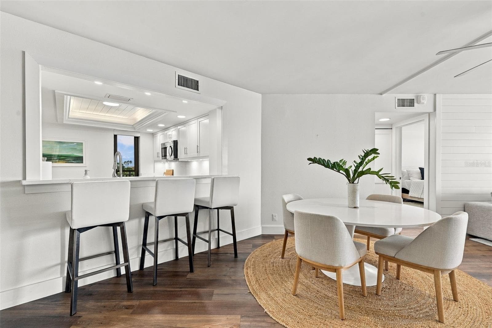 Kitchen bar overlooks the Dining Area and Living Room - 5700 ESCONDIDA BLVD S #401, ST PETERSBURG