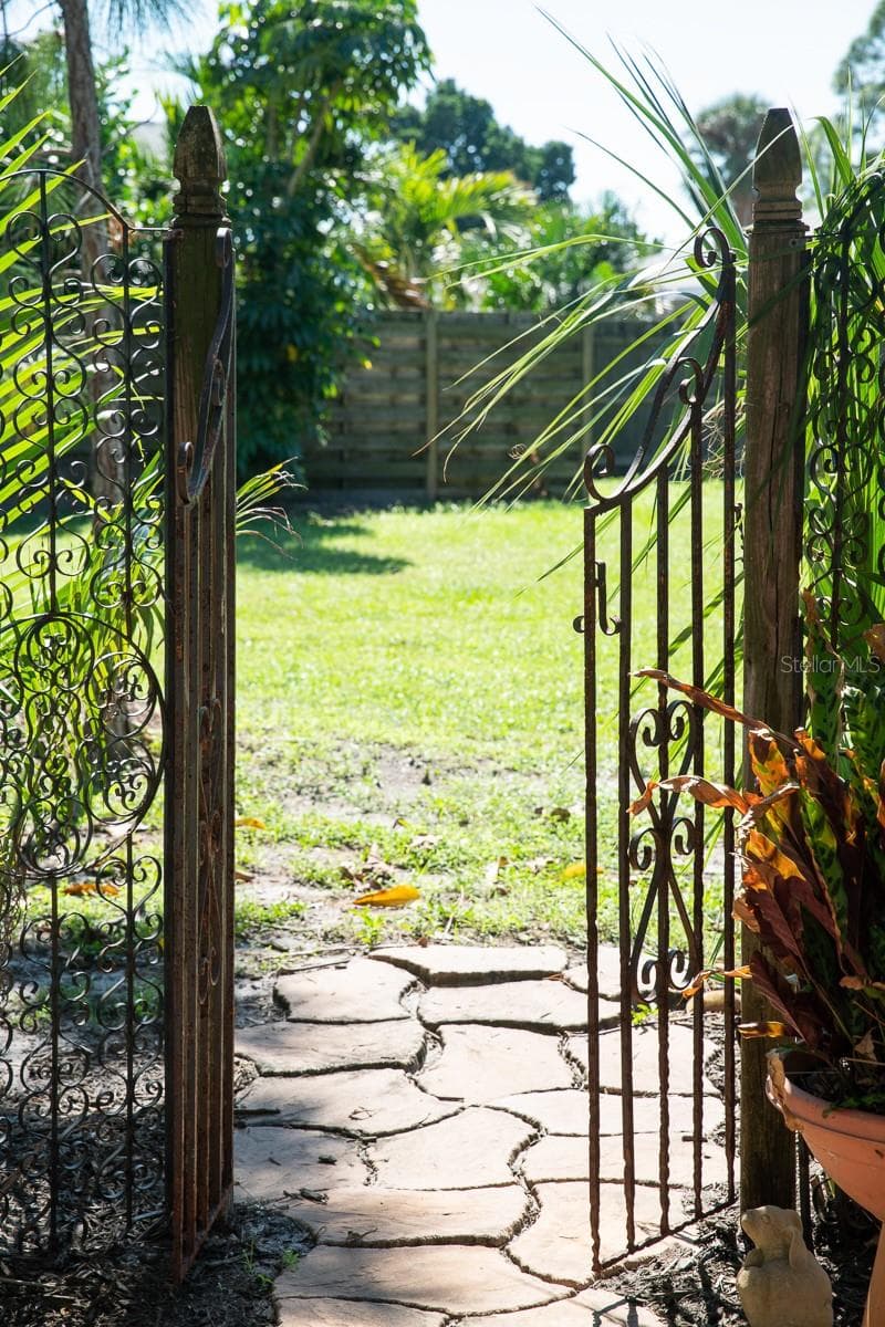 View from courtyard to open space. - 1230 ESTREMADURA DR, BRADENTON