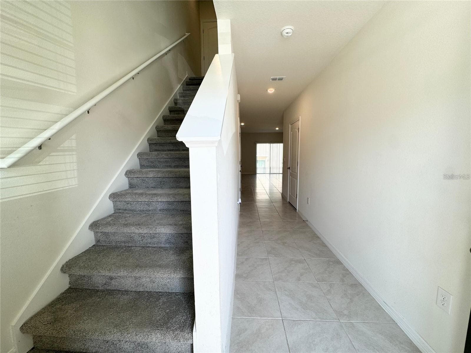 View toward second story, breezeway and closet. - 2353 PENGUIN BLVD, DAVENPORT