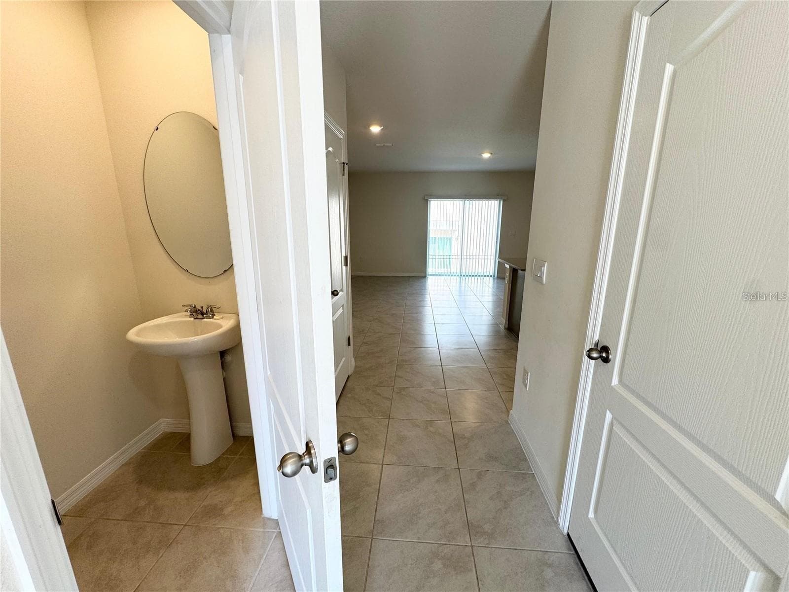 View from breezeway toward half bath, closet toward living room. - 2353 PENGUIN BLVD, DAVENPORT