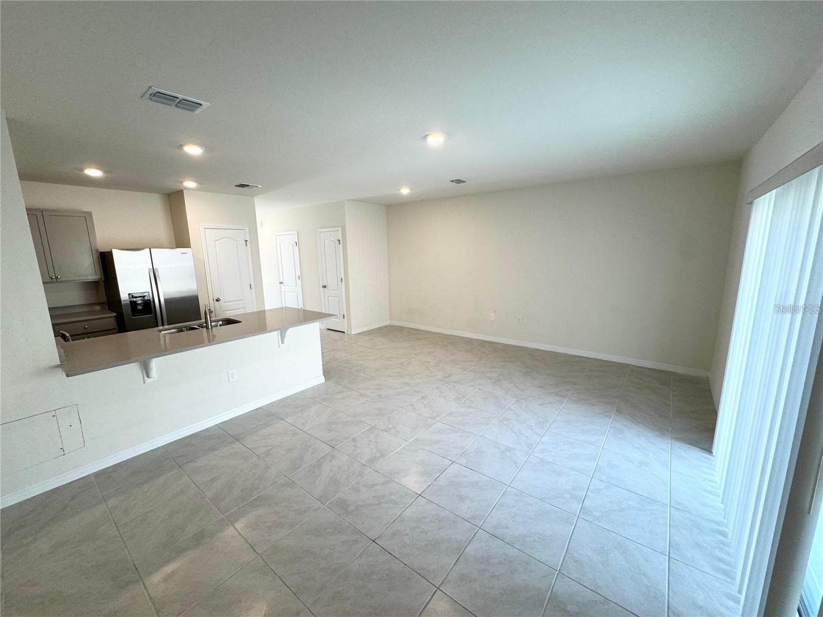 View from dining area, kitchen and living room area. - 2353 PENGUIN BLVD, DAVENPORT