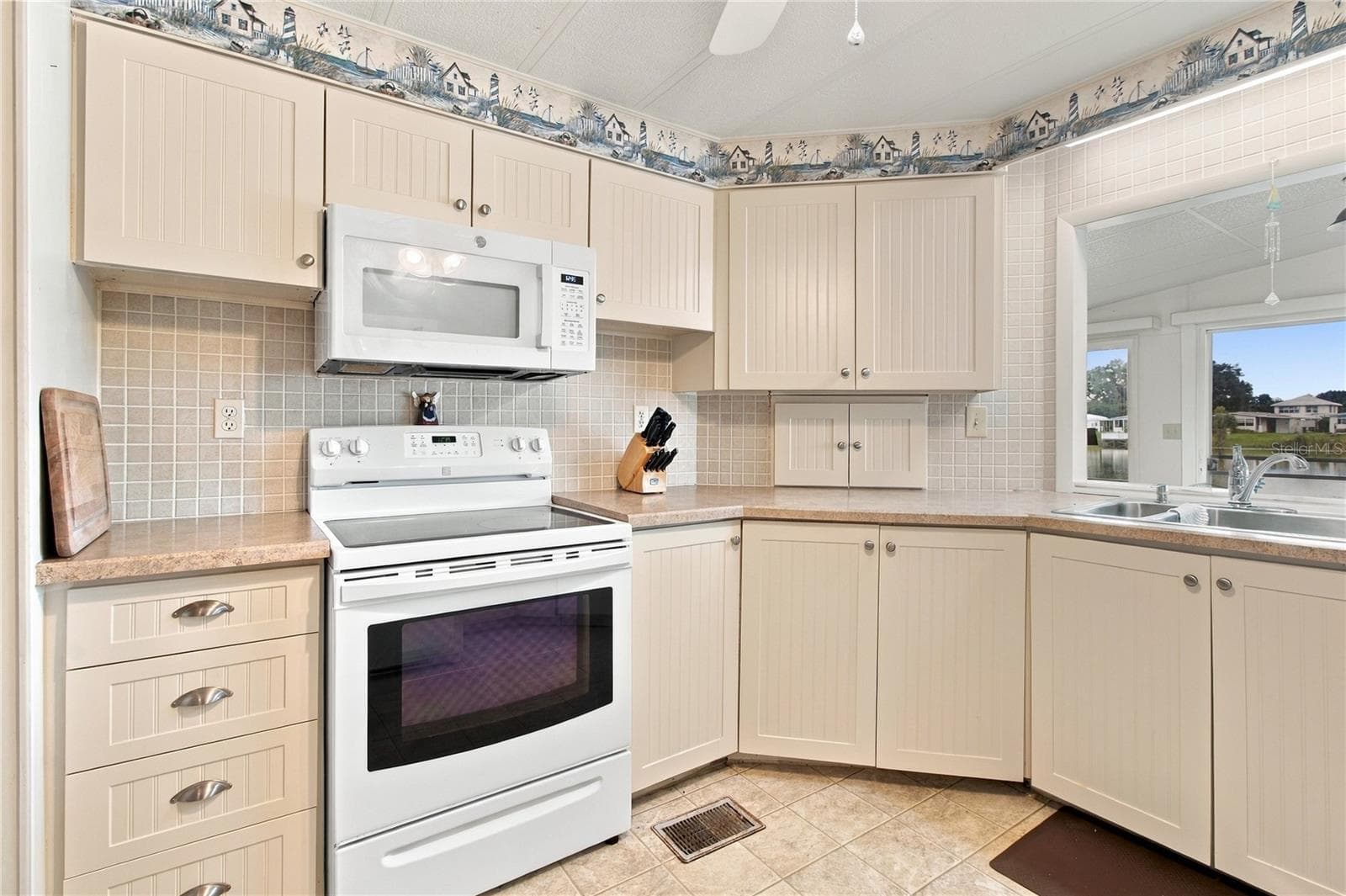 Kitchen great view of the lake. - 808 53RD AVE E #169, BRADENTON