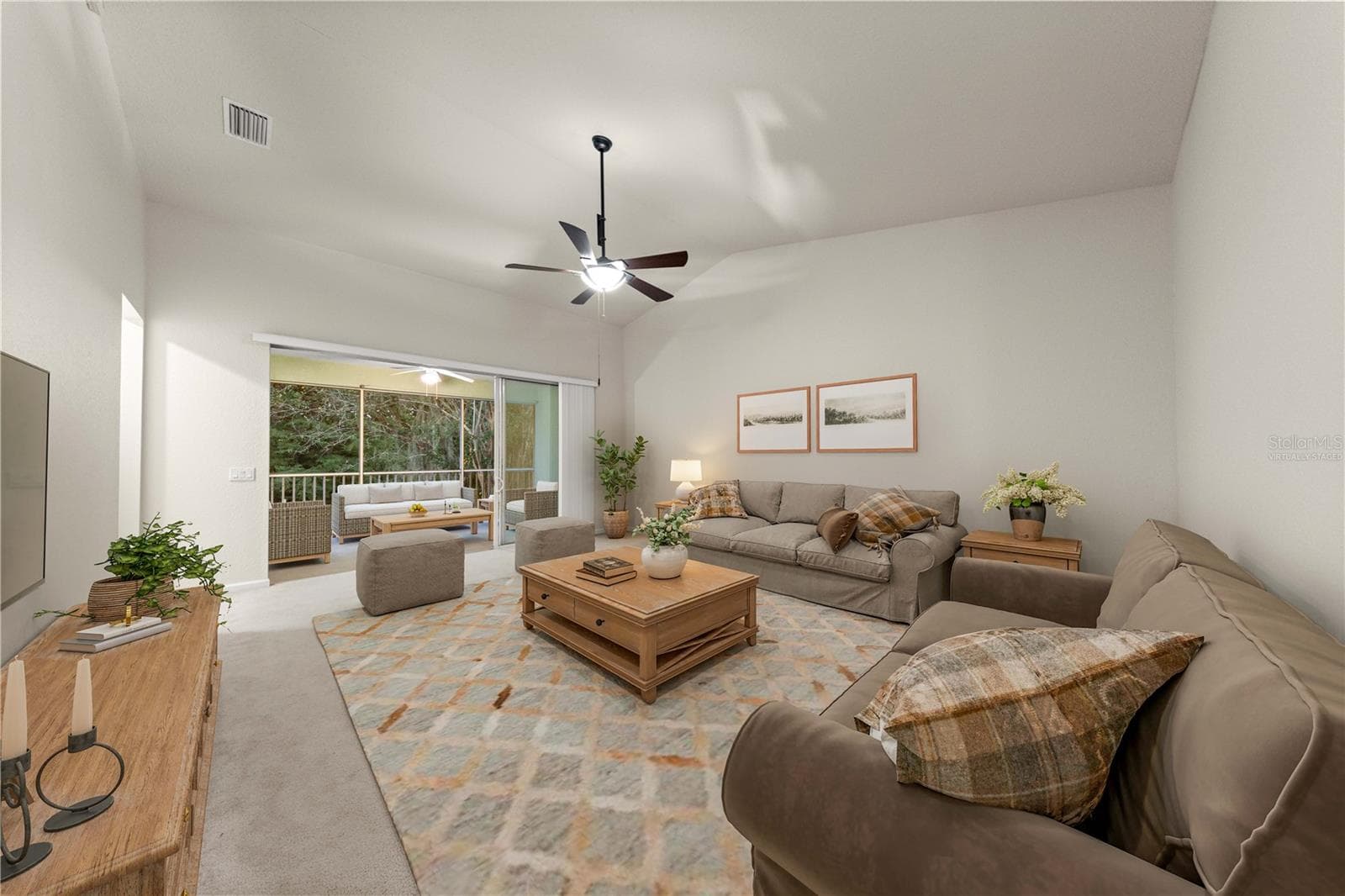 Virtually Staged. Ceiling fan, high ceilings, wooded backdrop - 4540 SW 52ND CIR #104, OCALA