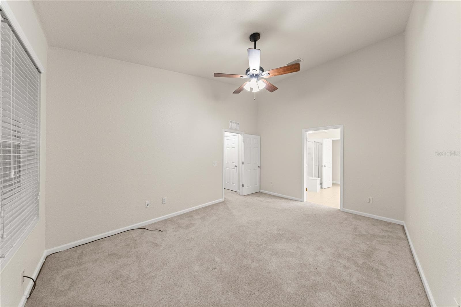 Primary Bedroom, upper floor, blinds included. Stylish ceiling fan, HUGE master bathroom - 4540 SW 52ND CIR #104, OCALA