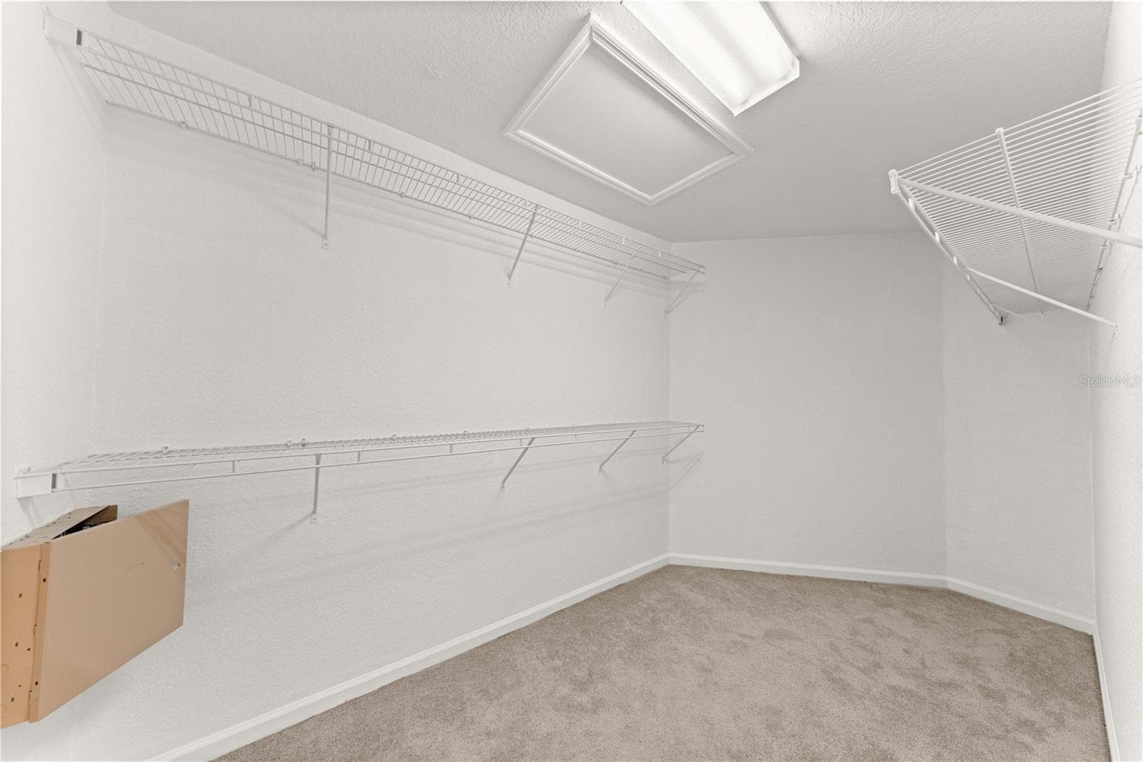 HUGE HUGE walk in primary closet with built in shelving - 4540 SW 52ND CIR #104, OCALA