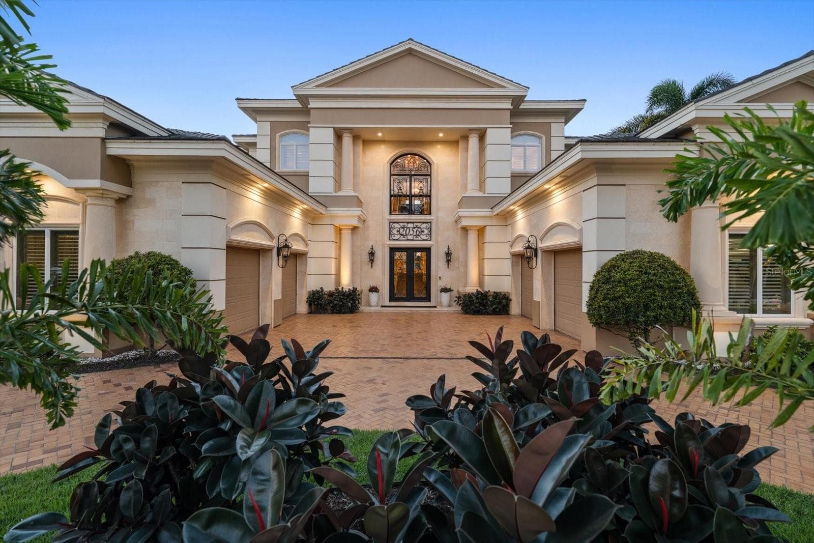 The Architectural Columns and Natural Gas Lanterns create a Memorable First Impression! - 2056 COVE TRCE, PALM HARBOR
