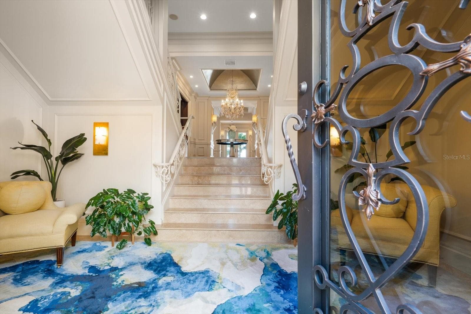 Limestone Tiled Entry and Custom Double Iron Front Doors - 2056 COVE TRCE, PALM HARBOR