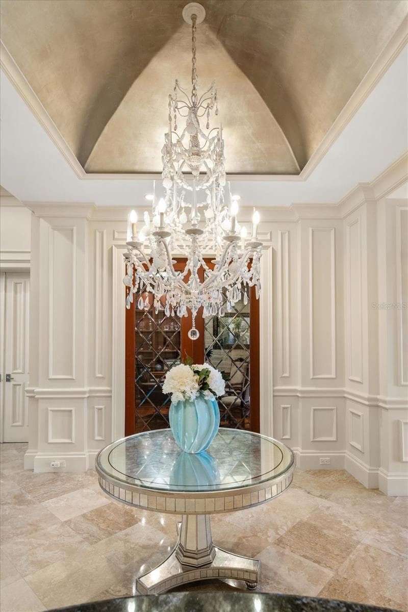 Elegant, High-End Light Fixtures throughout. Here is a Unique Chandelier with Gold Leaf Dome - 2056 COVE TRCE, PALM HARBOR