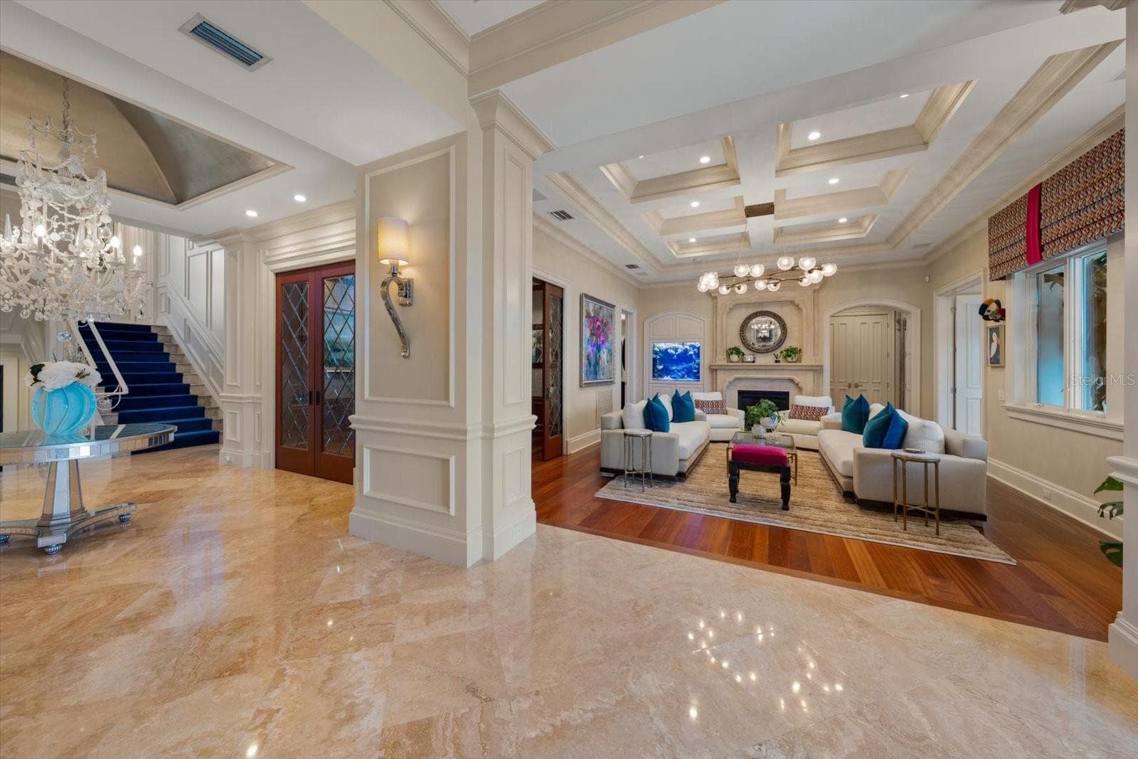 Statement chandeliers and a Built-in Saltwater Aquarium with live coral adds distinctive character! - 2056 COVE TRCE, PALM HARBOR