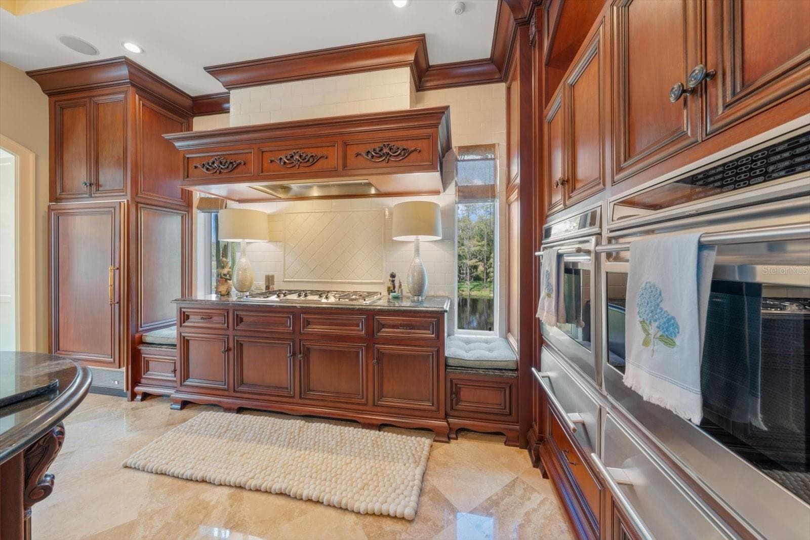 Thermador 6 burner gas range & side by side Wolf ovens with matching warming drawers. Two Miele dishwashers and a Sub-Zero paneled refrigerator - 2056 COVE TRCE, PALM HARBOR