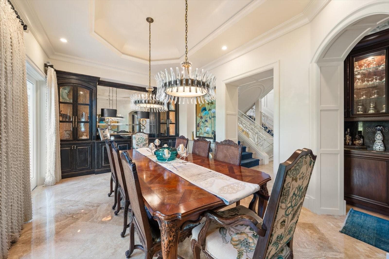 Illuminated Tray Ceiling, Statement Chandeliers & Arched Doorways - 2056 COVE TRCE, PALM HARBOR