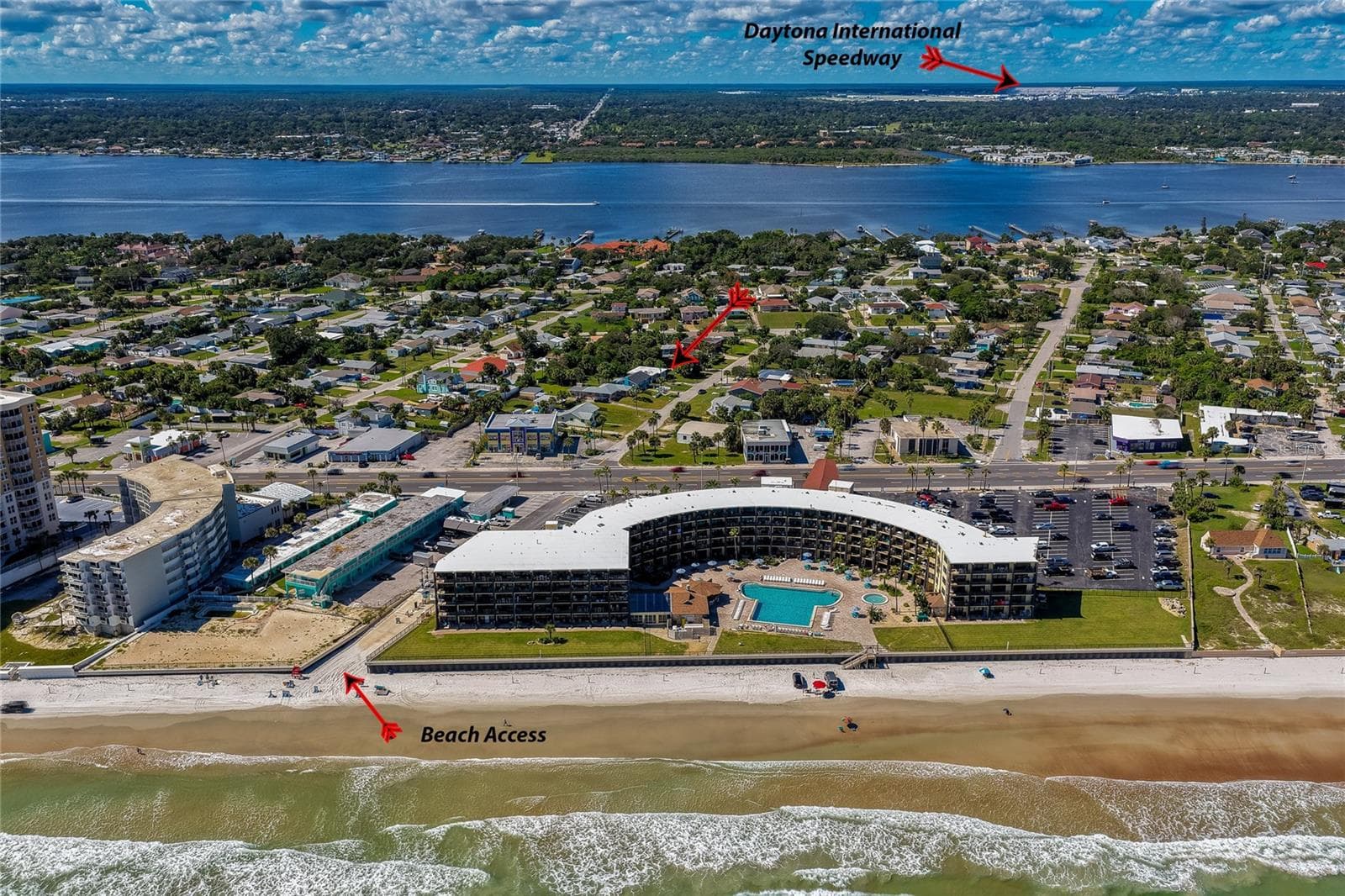 Broad coastal aerial showcase indicating key regional landmarks, including direct beach access routes and the nearby Daytona International Speedway. The surrounding area offers easy access to local amenities and beachside attractions. - 128 MINERVA RD, DAYTONA BEACH
